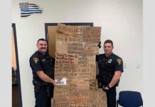 Police Officers Gift Their Supervisor Cardboard Signs Which Were Taken From Homeless People police-officers-gift-their-supervisor-cardboard-signs-which-were-taken-from-homeless-people