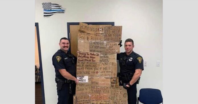 police-officers-gift-their-supervisor-cardboard-signs-which-were-taken-from-homeless-people