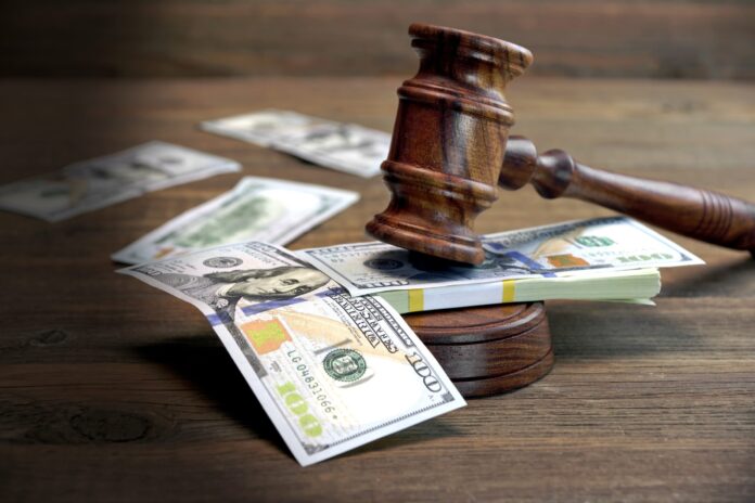 Concept For Corruption, Bankruptcy Court, Bail, Crime, Bribing, Fraud, Auction Bidding. Judges or Auctioneer Gavel, Soundboard And Bundle Of Dollar Cash On The Rough Wooden Textured Table Background.